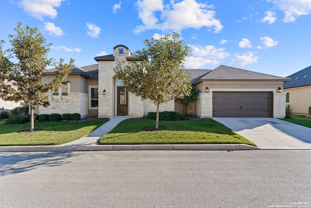 view of front of property featuring a garage, stone siding, concrete driveway, and a front yard