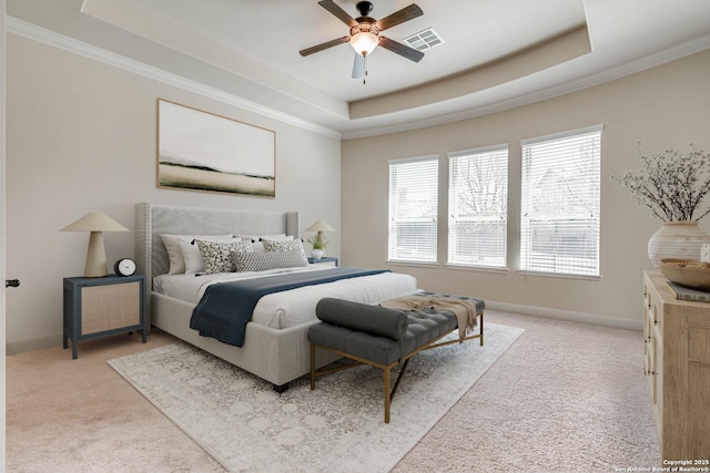 bedroom featuring a raised ceiling, baseboards, and visible vents