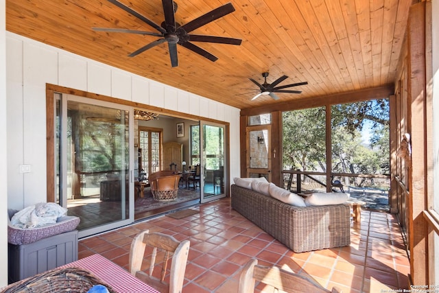 sunroom with wooden ceiling and a ceiling fan