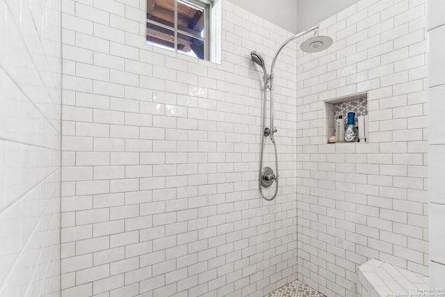 full bathroom featuring tiled shower