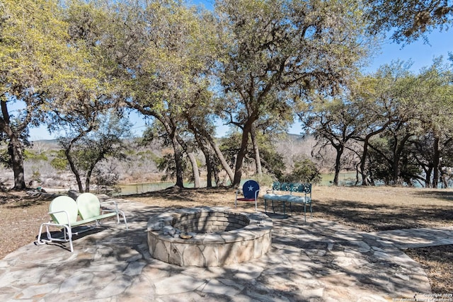 view of patio with a fire pit