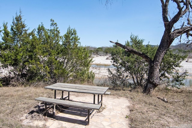 surrounding community featuring a water view