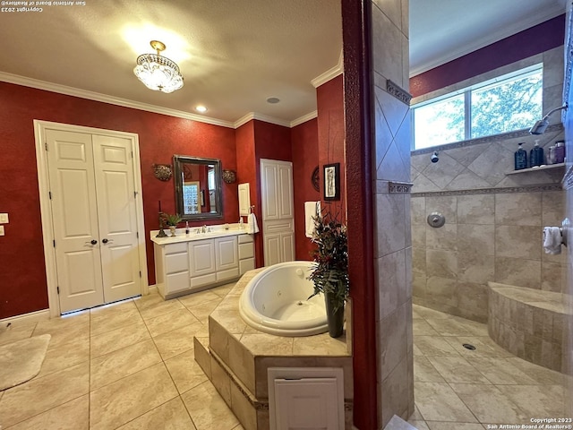 full bath with tile patterned flooring, crown molding, walk in shower, a whirlpool tub, and vanity