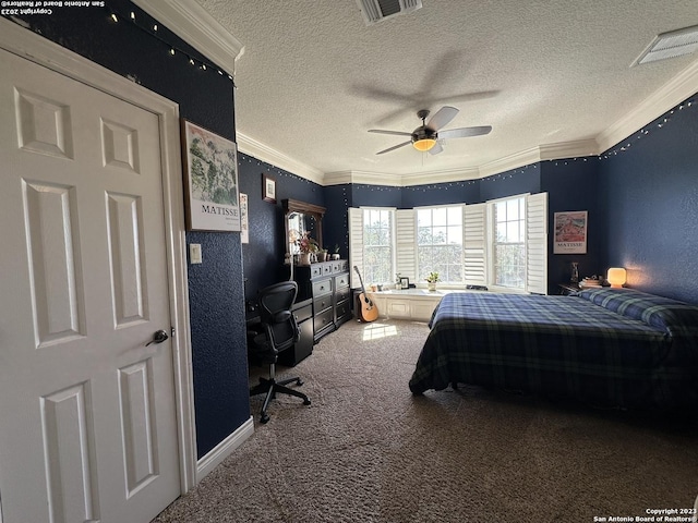 bedroom featuring a textured ceiling, carpet, visible vents, and ornamental molding