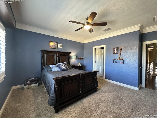 bedroom with visible vents, light carpet, ornamental molding, a textured ceiling, and baseboards