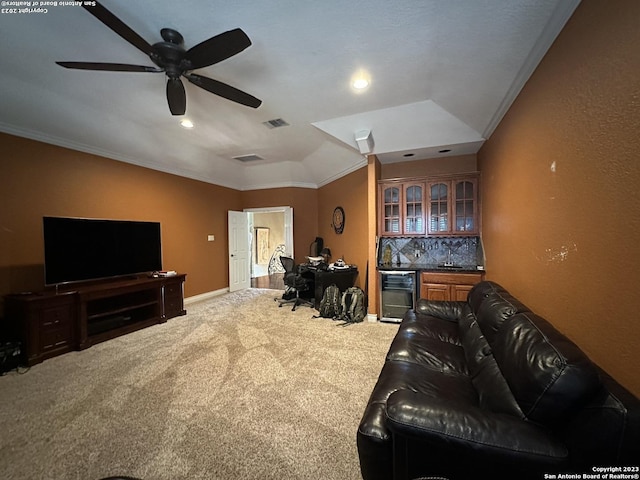 carpeted living area featuring visible vents, baseboards, beverage cooler, and a ceiling fan