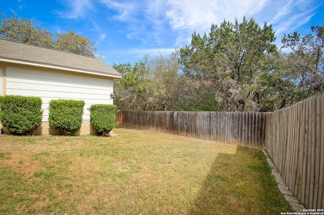 view of yard featuring a fenced backyard