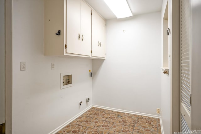 laundry room featuring hookup for a washing machine, baseboards, gas dryer hookup, cabinet space, and stone finish floor