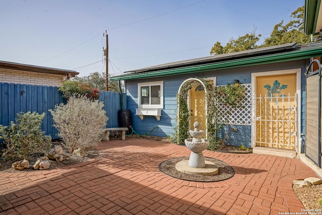 view of patio / terrace featuring fence