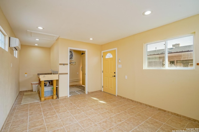 interior space with recessed lighting, an AC wall unit, light tile patterned flooring, and a healthy amount of sunlight