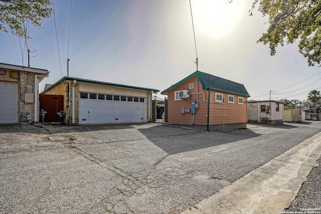 view of front of property with an outbuilding and a garage