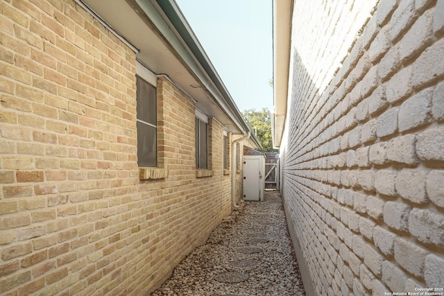 view of home's exterior with brick siding