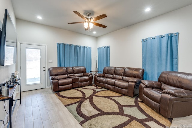 living room featuring recessed lighting, ceiling fan, and light wood finished floors