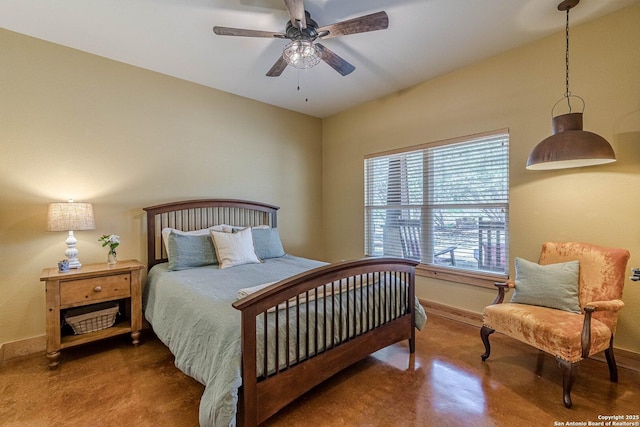 bedroom featuring a ceiling fan, baseboards, and concrete flooring