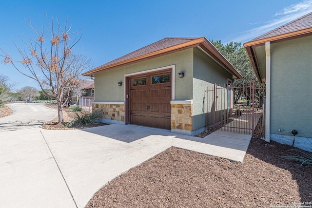 exterior space with concrete driveway and fence