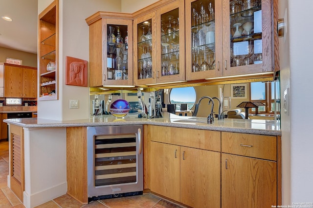 bar featuring recessed lighting, beverage cooler, indoor bar, and a sink