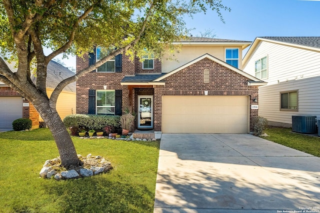 traditional home with brick siding, a front yard, an attached garage, and driveway