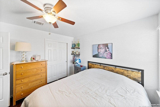 bedroom featuring visible vents, a closet, and ceiling fan