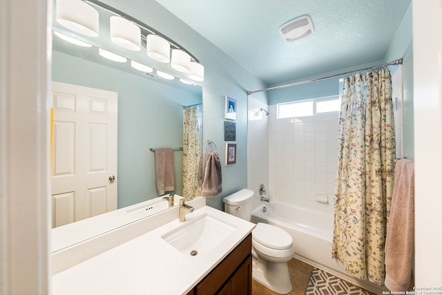 full bath with visible vents, toilet, shower / tub combo with curtain, a textured ceiling, and vanity