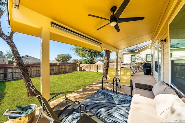 view of patio featuring grilling area, a ceiling fan, and a fenced backyard