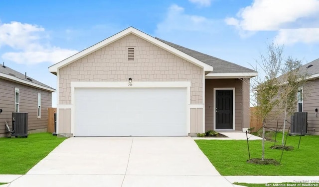 single story home with concrete driveway, an attached garage, a front yard, and central AC