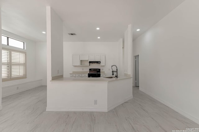 kitchen featuring visible vents, recessed lighting, a sink, black range with electric cooktop, and under cabinet range hood