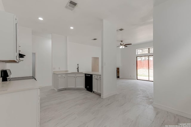 kitchen featuring visible vents, marble finish floor, a ceiling fan, a sink, and range