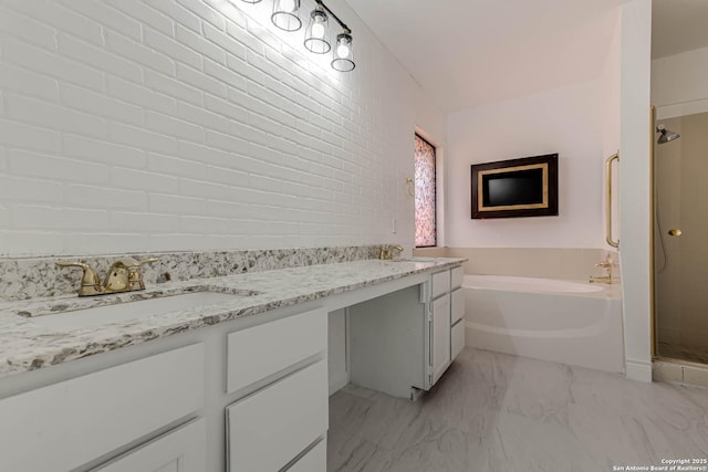 bathroom featuring a shower stall, vanity, marble finish floor, and a garden tub