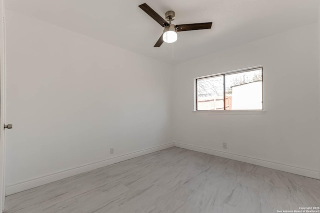 unfurnished room with baseboards and ceiling fan