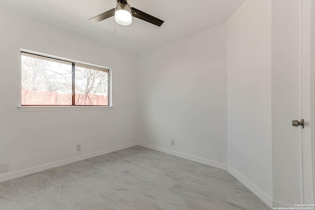 unfurnished room featuring baseboards and ceiling fan