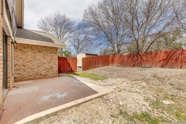 view of yard featuring a patio and fence