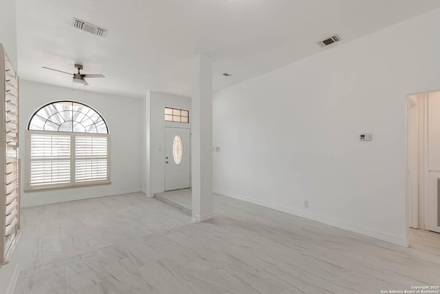 foyer featuring visible vents, marble finish floor, baseboards, and a ceiling fan