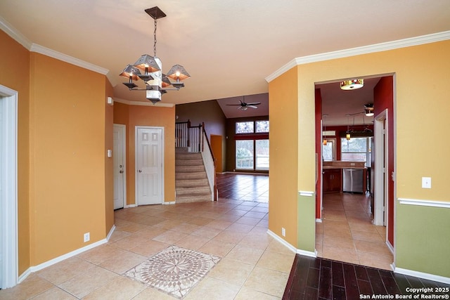 foyer featuring baseboards, stairs, and crown molding