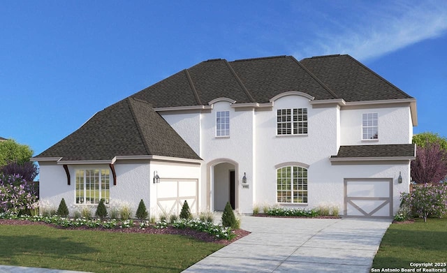 french country inspired facade featuring stucco siding, concrete driveway, and a front lawn