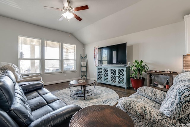 living room featuring baseboards, wood finished floors, ceiling fan, and vaulted ceiling