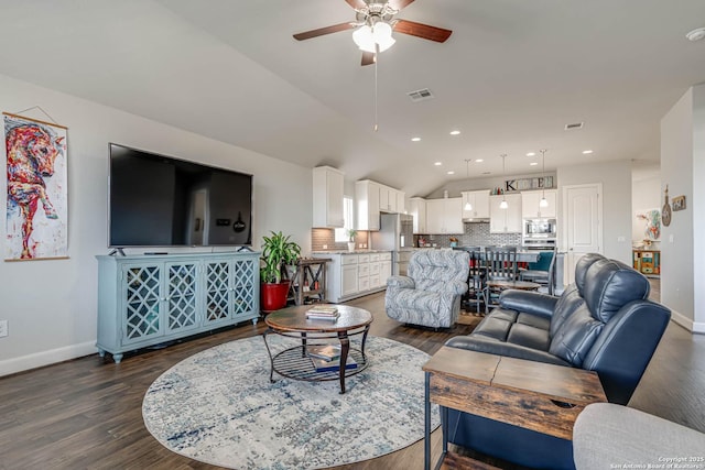 living room with visible vents, dark wood-type flooring, a ceiling fan, baseboards, and lofted ceiling