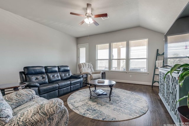 living area with dark wood finished floors, lofted ceiling, baseboards, and ceiling fan