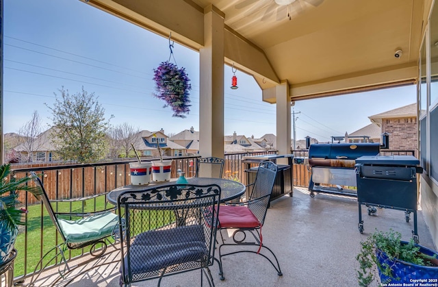 view of patio featuring outdoor dining space and fence