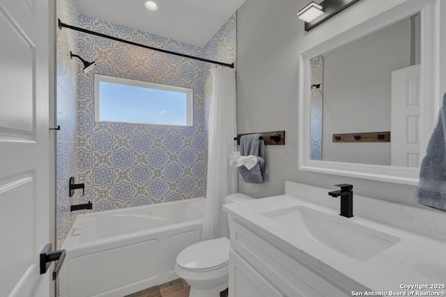 full bathroom featuring vanity, toilet, and shower / tub combo