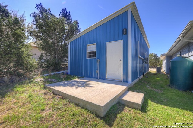 view of outbuilding with cooling unit and an outbuilding