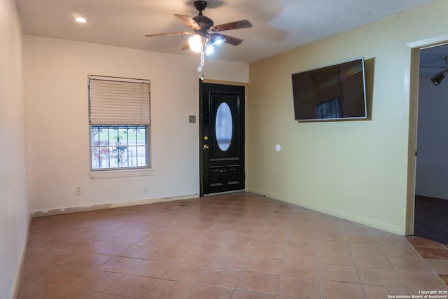 entrance foyer featuring light tile patterned floors, baseboards, recessed lighting, and a ceiling fan