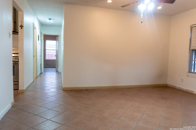 spare room featuring light tile patterned floors, baseboards, ceiling fan, and recessed lighting