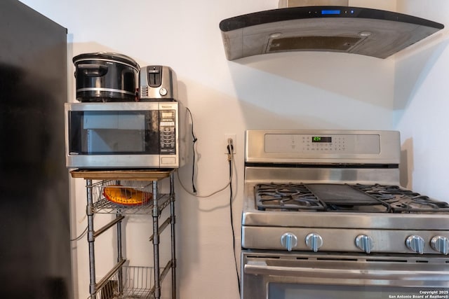 kitchen with under cabinet range hood and stainless steel appliances