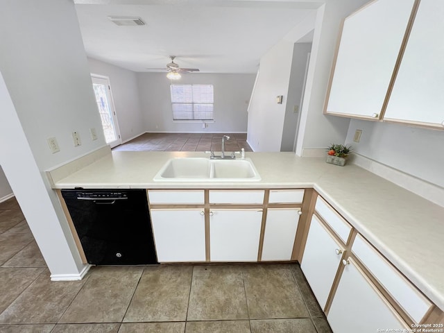 kitchen featuring visible vents, a sink, black dishwasher, white cabinetry, and ceiling fan