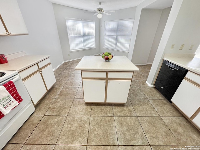 kitchen featuring dishwasher, light tile patterned flooring, and white cabinetry