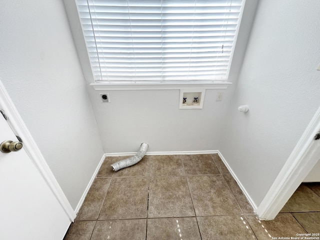 laundry area featuring tile patterned floors, baseboards, hookup for an electric dryer, hookup for a washing machine, and laundry area