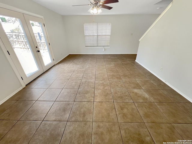 unfurnished room featuring tile patterned flooring, french doors, baseboards, and ceiling fan