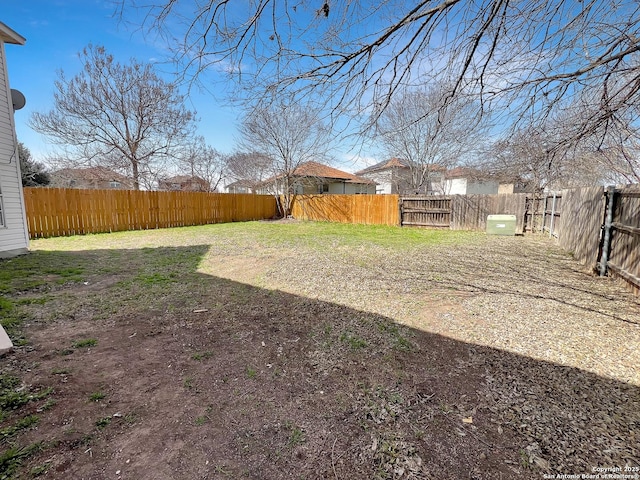 view of yard with a fenced backyard