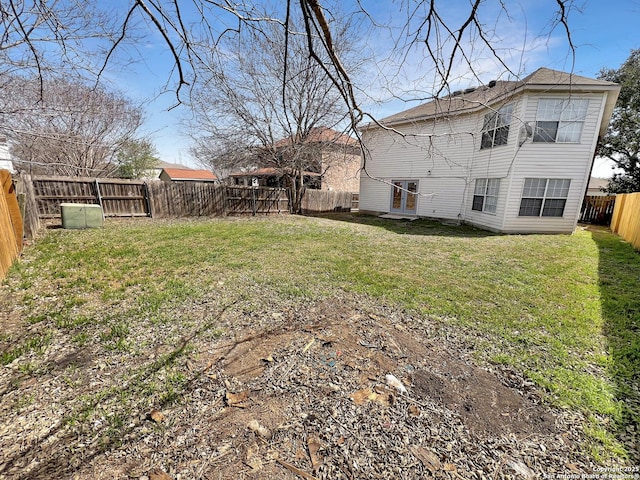 view of yard with a fenced backyard