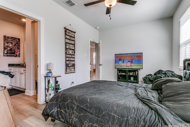 bedroom featuring visible vents and light wood finished floors